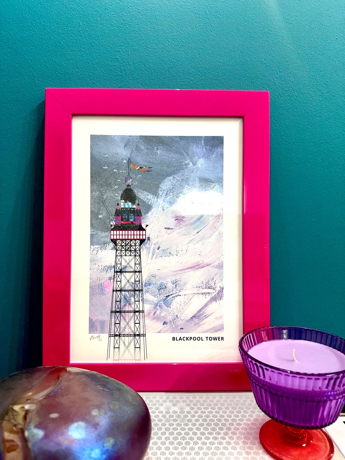 Blackpool Tower seconds framed artwork by Vicki Shortt, pink background, shown on a wall