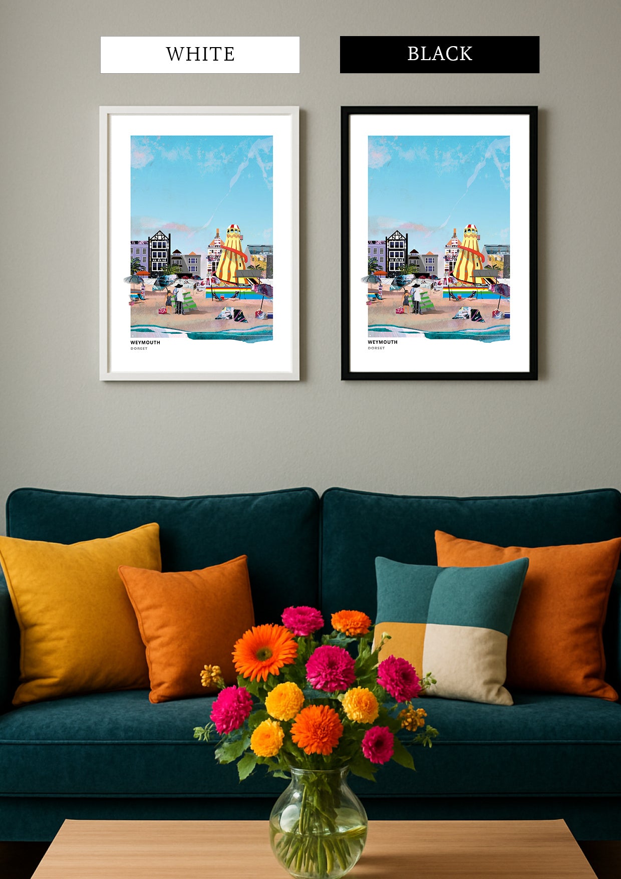 A styled interior scene showing two framed art prints hanging above a dark teal sofa with orange and teal cushions and a flower vase on a wooden table. The prints depict a colourful beach scene with a yellow sailboat.