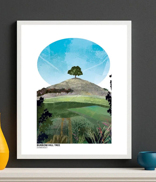 Burrow Hill Tree art print by Vicki Shortt, the lone tree on the crown of Burrow Hill in Somerset, Greens colourway, framed in a room setting