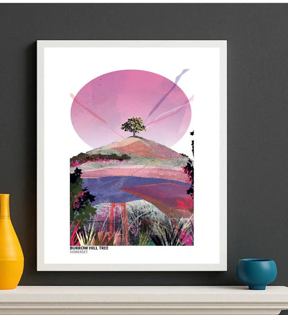 Burrow Hill Tree art print by Vicki Shortt, the lone tree on the crown of Burrow Hill in Somerset, Pinks colourway, framed in a room setting
