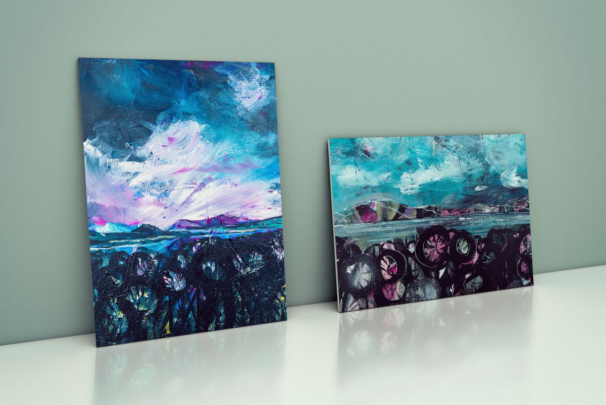 Two original Vicki Shortt artworks resting against a sage green wall