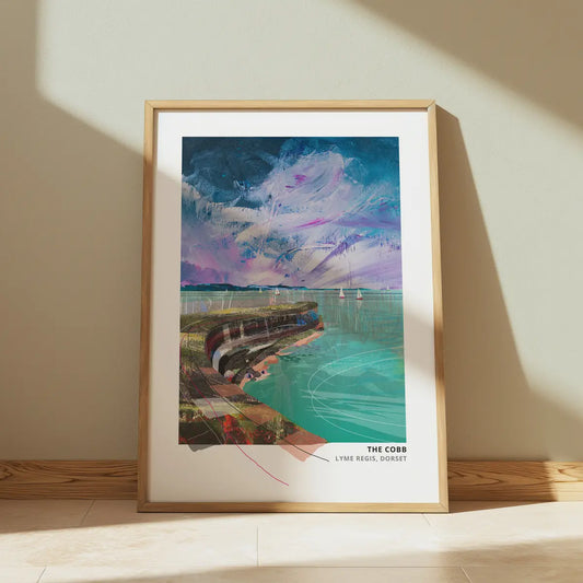 The Cobb art print by Vicki Shortt, the curving harbour wall at Lyme Regis, Dorset, framed in a room setting