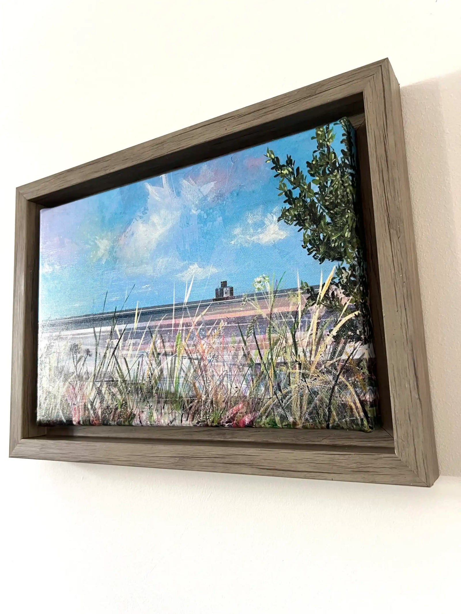 Vicki Shortt landscape art prints displayed on the walls of a corporate workspace