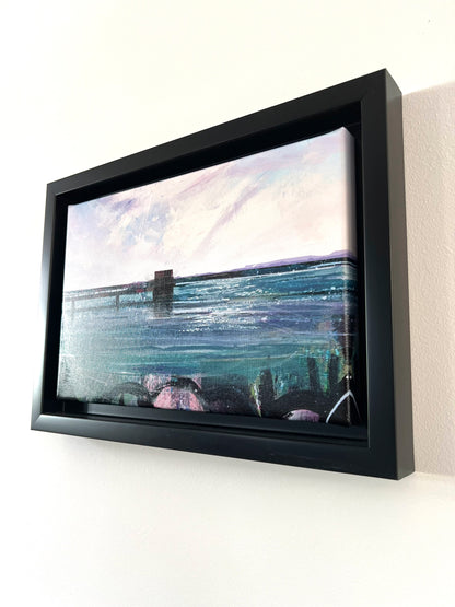 Covenham Reservoir original artwork by Vicki Shortt, the bank and open water of Covenham Reservoir, Lincolnshire, the framed canvas seen at an angle