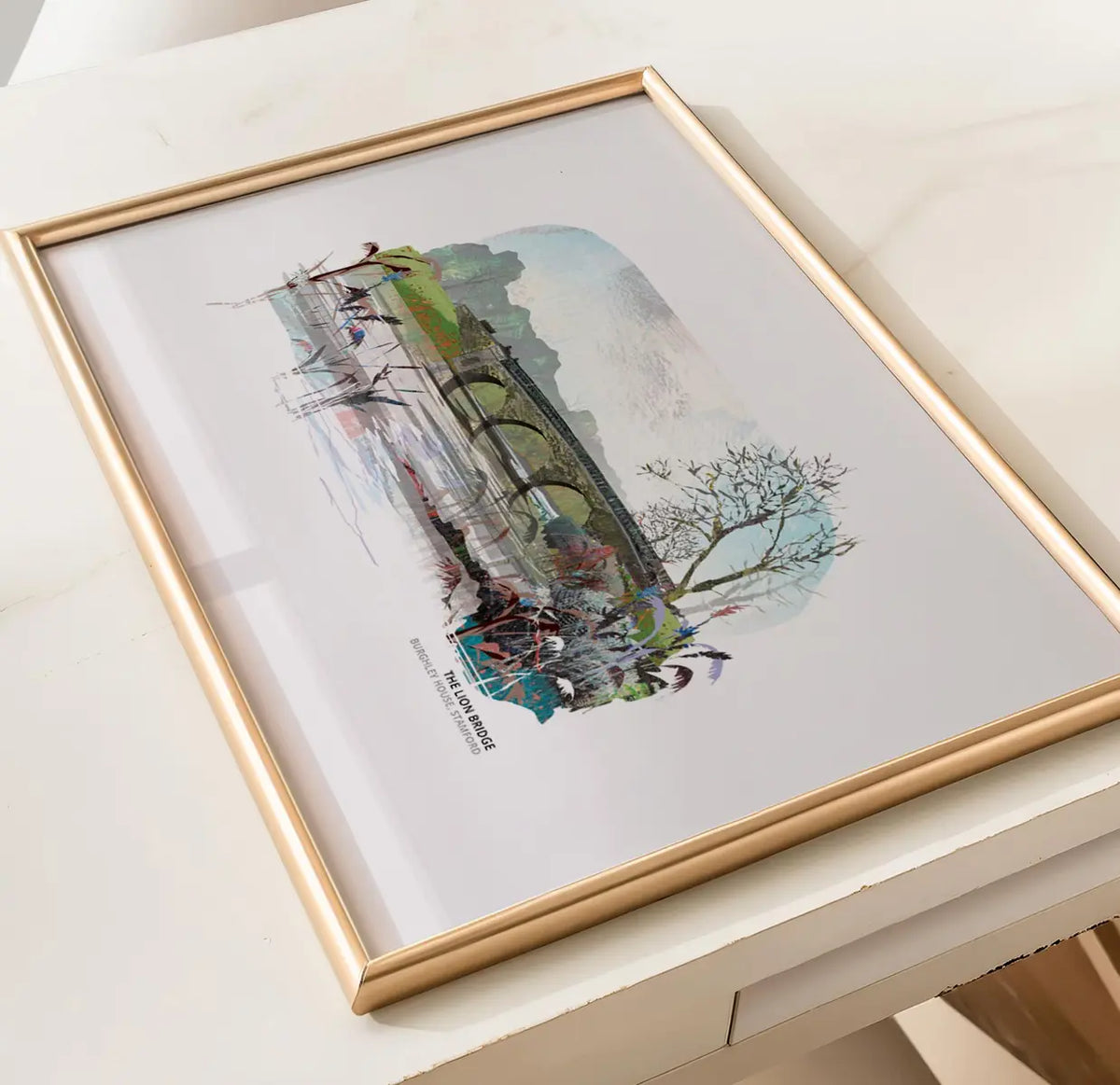 The Lion Bridge art print by Vicki Shortt, Capability Brown's stone bridge across the lake in Burghley Park, Stamford, framed in a room setting