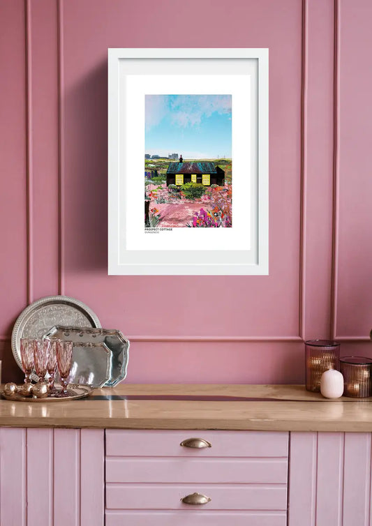Prospect Cottage art print by Vicki Shortt, Derek Jarman's black timber cottage on the shingle at Dungeness, Kent, framed in a room setting