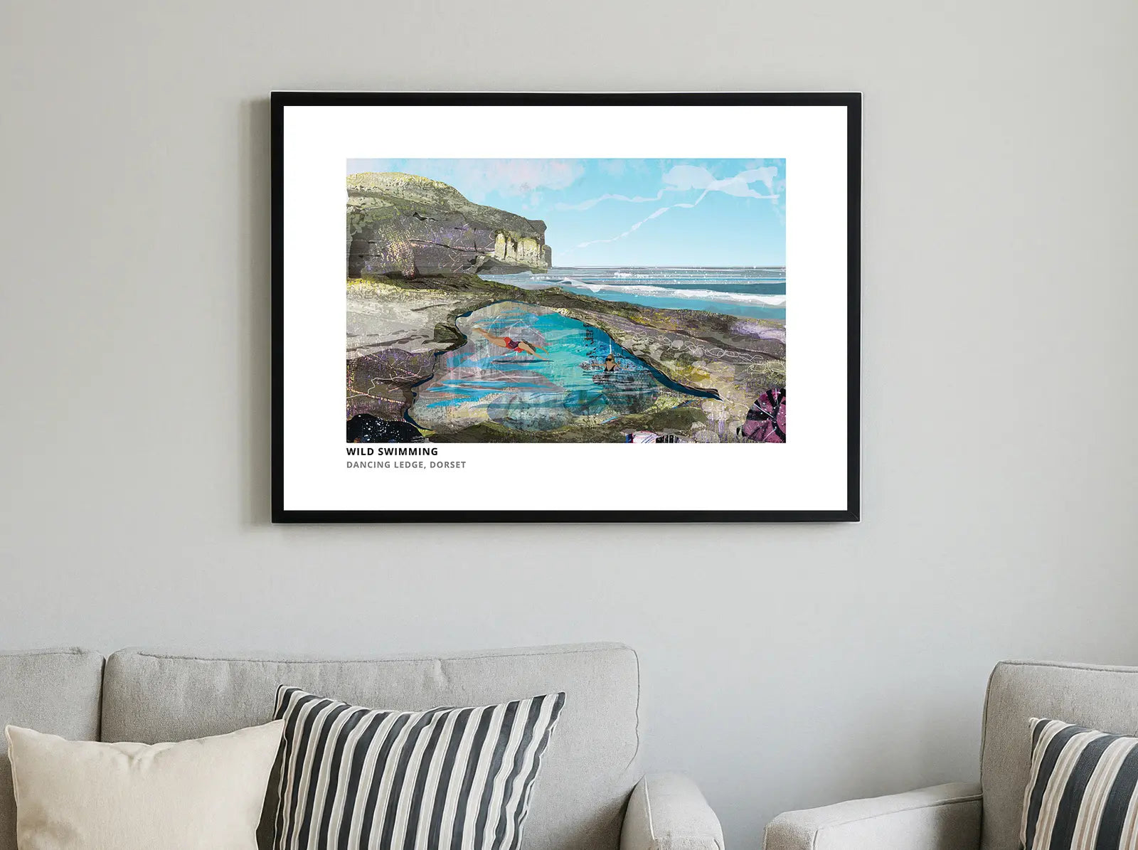 Wild Swimming Dorset art print by Vicki Shortt, swimmers at the rock pool at Dancing Ledge on the Dorset coast, framed in a room setting